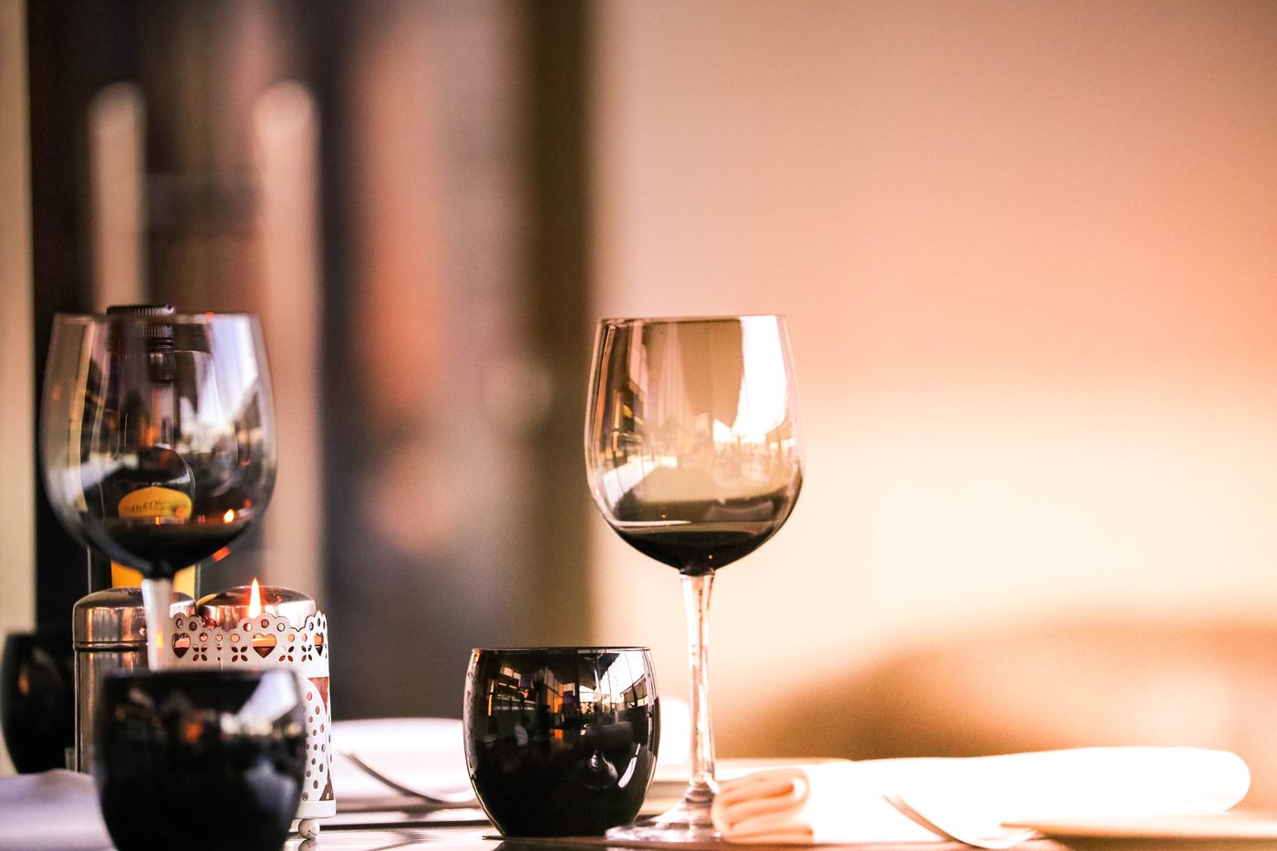 Candlelit table with wine glasses