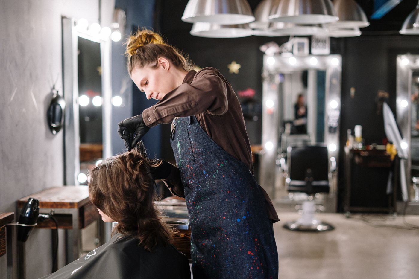 Colourist painting balayage highlights