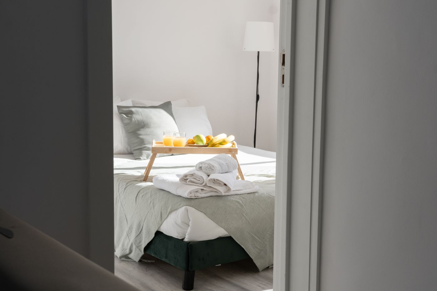 Linen bedding detail in a sunlit room
