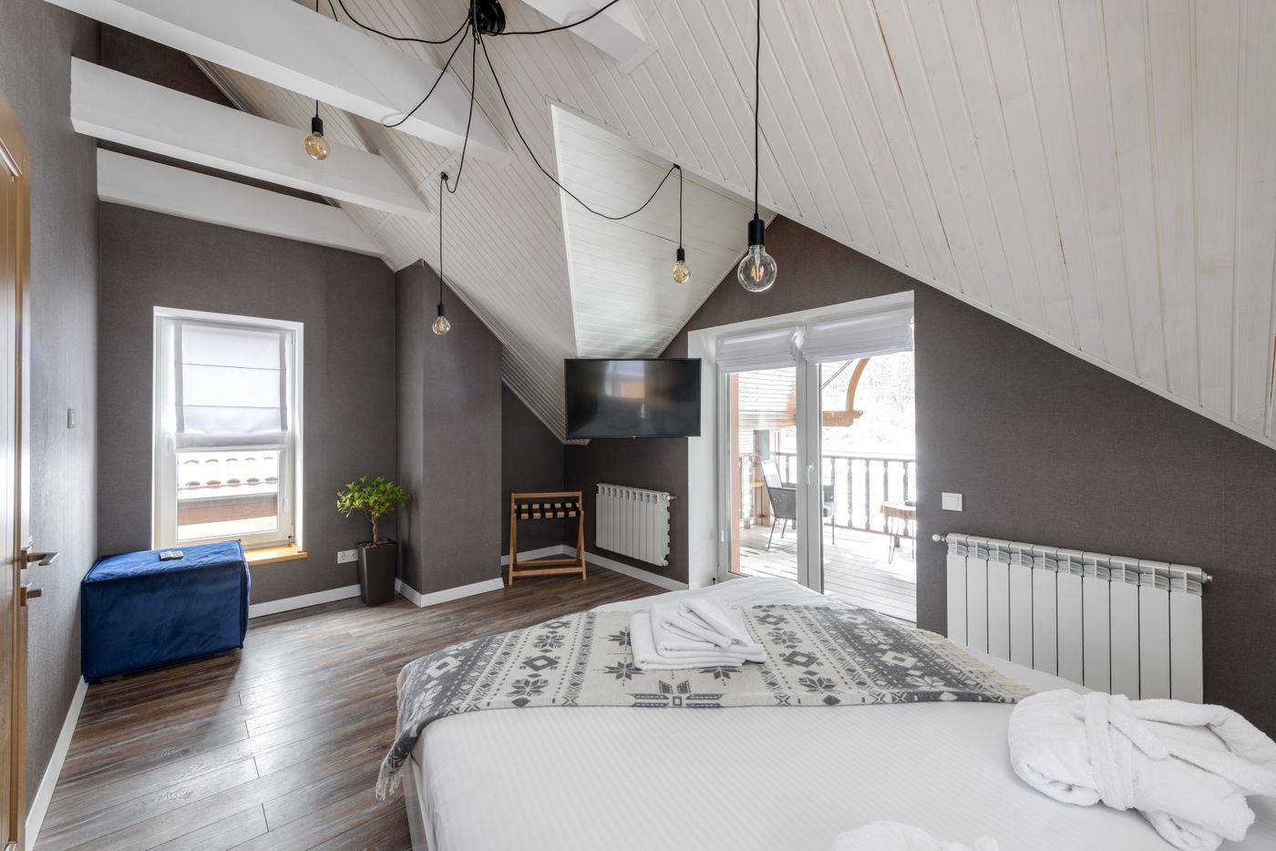 Sunlit guest room with linen bedding and vintage furniture