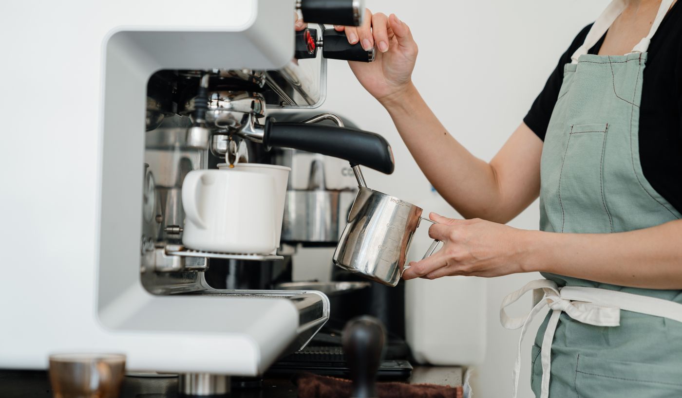 Barista steaming milk