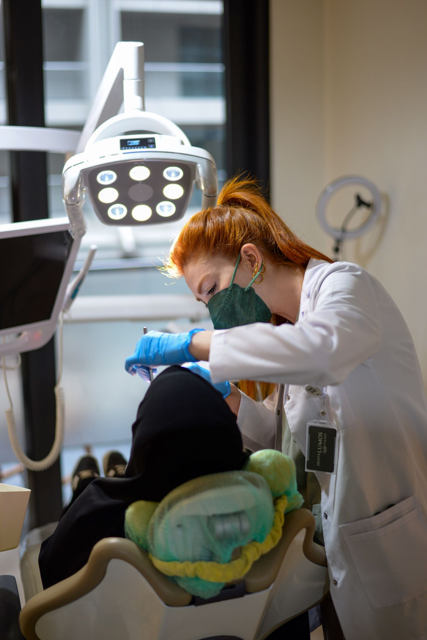 Dentist performing a checkup in a bright clinic