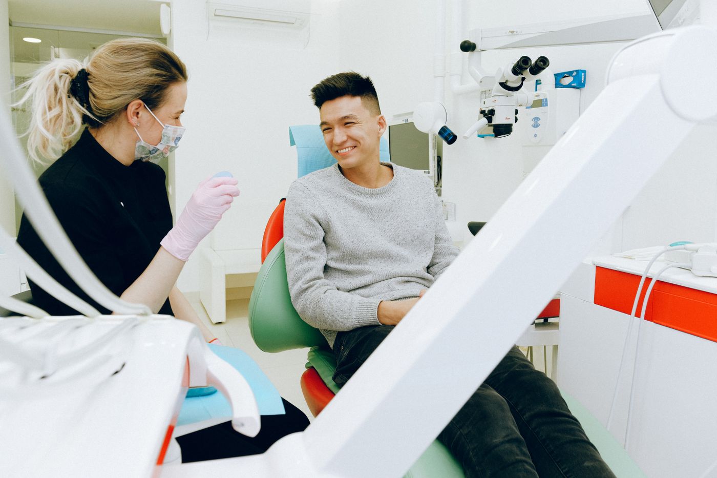 Patient smiling in a bright modern dental clinic