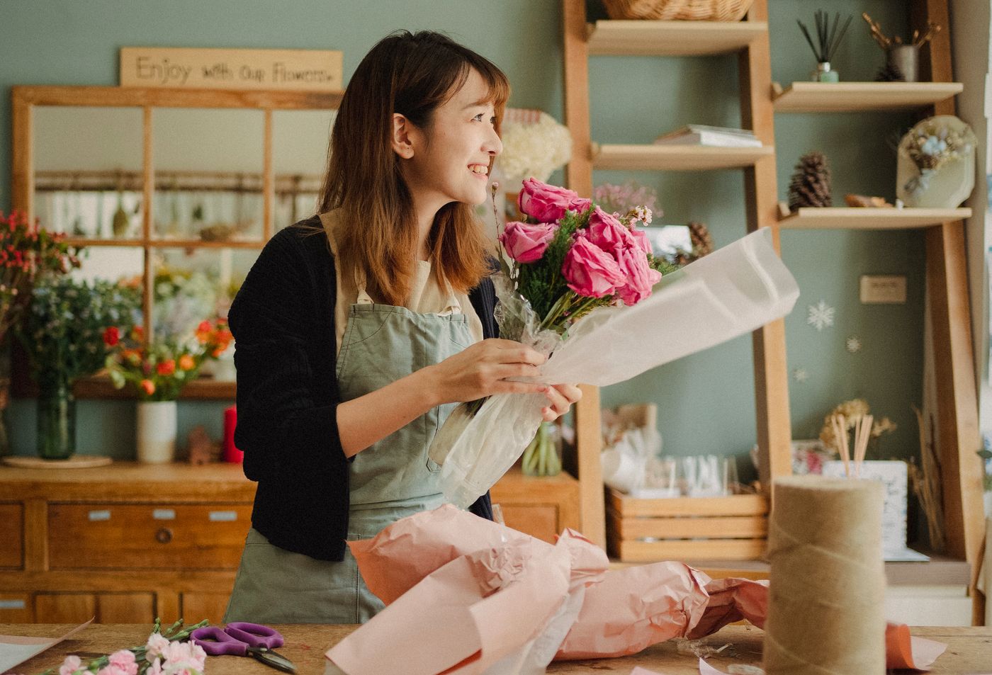 Florist arranging a loose garden-style bouquet