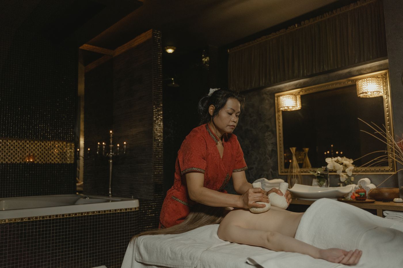 Serene spa treatment room with soft light and stones