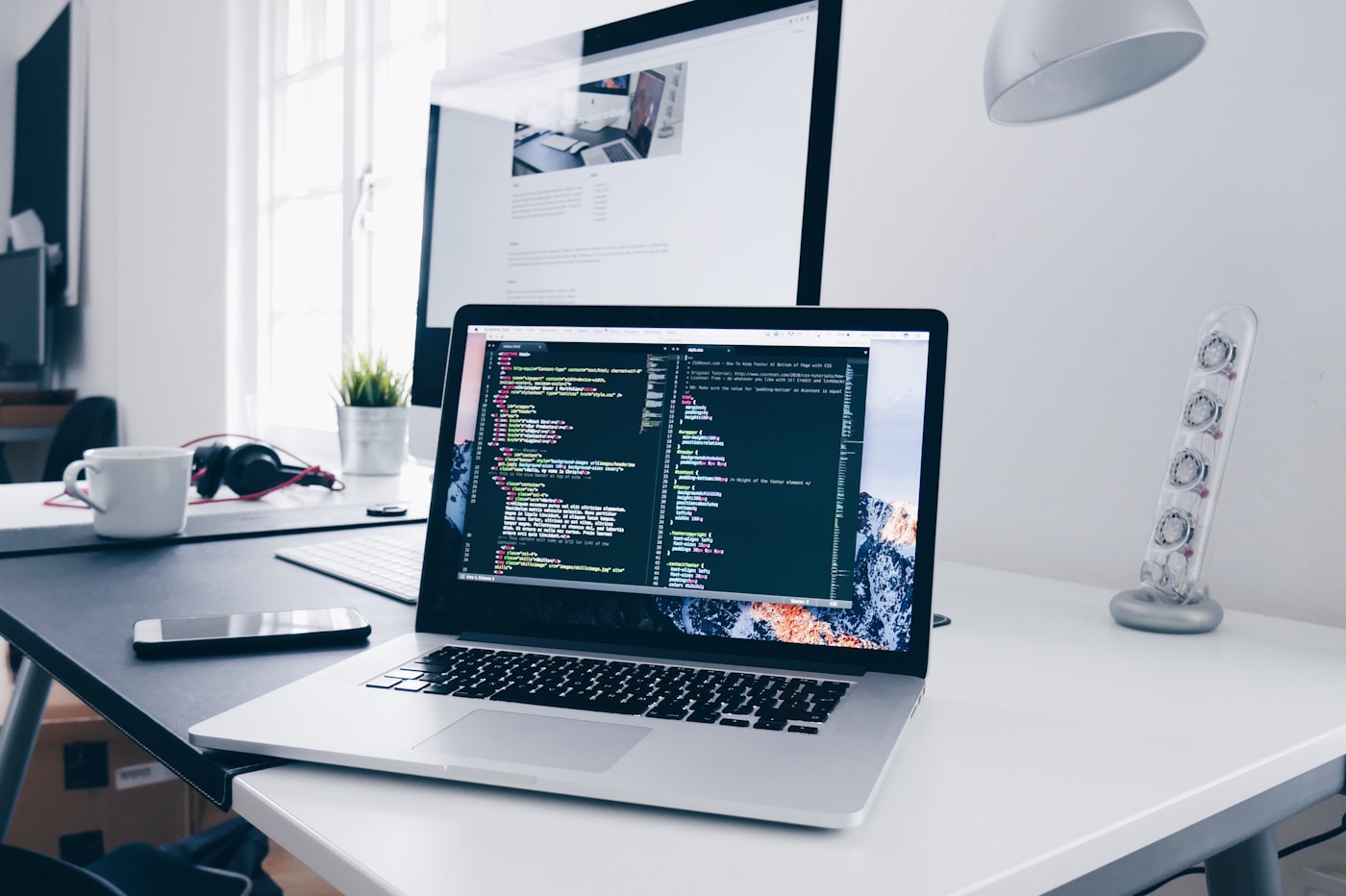 Code and design work on a laptop